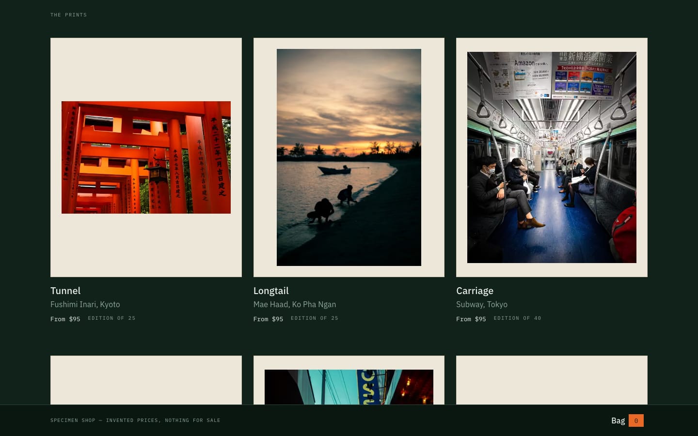 The print store's grid — three photographs mounted on off-white mat board against a deep green gallery wall, each with a wall label giving its title, its place, a specimen price and an edition size, and a bag rail fixed across the bottom of the screen.